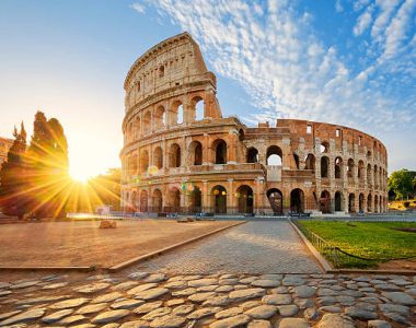 View of Colosseum in Rome and morning sun, Italy, Europe.